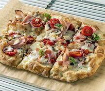 Пицца с ветчиной и грибами