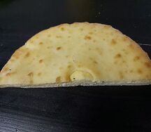 Осетинский с сыром половина