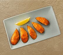 Мидии, запечённые под спайси-соусом