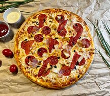 Пицца мясное ассорти