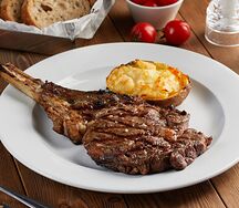 Стейк Ribeye с запечённым картофелем и сыром