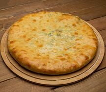 Осетинский пирог с сыром и зеленым луком