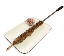 Шашлык из говяжьей печени в жировой сетке