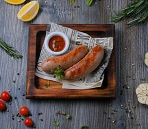 Колбаски свиные с тушеной капустой