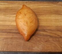 Пирожок печеный с капустой и яйцом