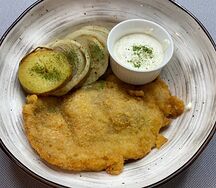 Cвинoй шницель с запеченным картофелем