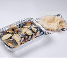 Мидии с грушей, пармезаном и сливками