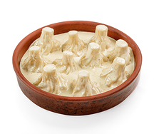 Мини-хинкали с курицей в сырном соусе