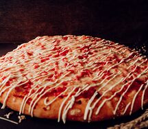 Пицца с ветчиной на пышном тесте