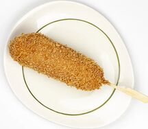 Корн-дог с сыром в пышном кляре и сухарях панко