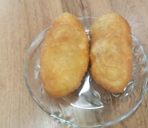 Пирожок с мясом печеный