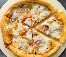 Пицца с ветчиной и грибами