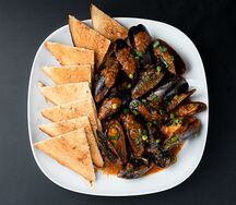 Мидии в томатном соусе