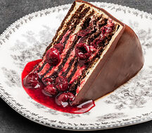 Вишневый медовик в молочном шоколаде и соусом из сезонный ягод 