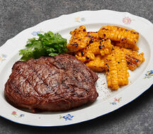 Рибай с печеной кукурузой