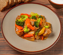 Свинина, тушенная с овощами