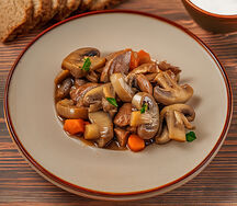 Свинина, тушенная с грибами