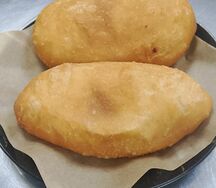 Пирожок жареный во фритюре капустой и яйцом