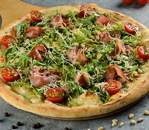 Пицца с пармской ветчиной