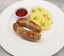 Колбаски свиные с соусом сацебели