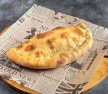 Закрытая пицца с ветчиной