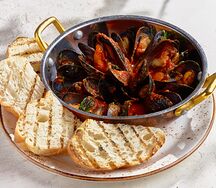 Соте мидий в томатном соусе