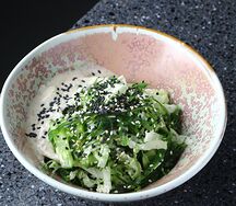 Салат с чука, китайской капустой и ореховым соусом