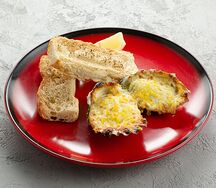 Запеченные устрицы под сырным соусом