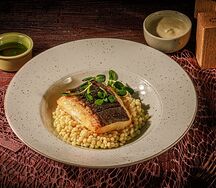 Палтус с птитимом и зелёным сливочным соусом
