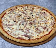 Пицца с ветчиной и шампиньонами