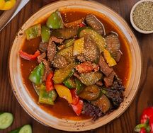 Говядина в фольге с овощами