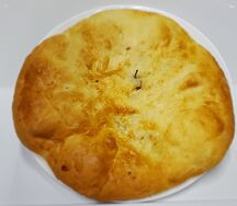 Осетинский пирог сыр и зелень