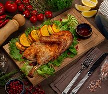 Утка запеченная с апельсинами и яблоками