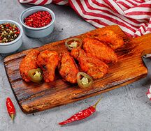 Куриные крылышки в соусе Острый Чак