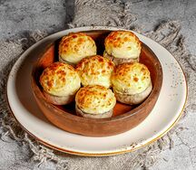 Шапочки шампиньонов под сыром