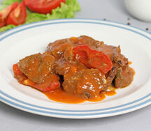 Говядина, тушенная с овощами
