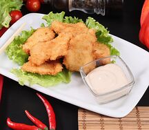 Наггетсы куриные с соусом Цезарь
