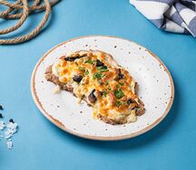 Свиная вырезка с шампиньонами под сыром