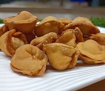 Пельмени со свининой и говядиной жареные