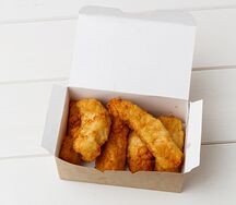 Куриные стрипсы в панировке