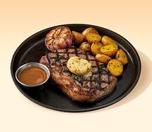 Стейк Стриплойн с картофелем стоун и пряным маслом