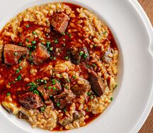 Полба с говяжьими щечками и белыми грибами