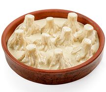 Мини-хинкали с курицей в сырном соусе