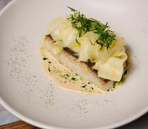 Палтус с маринованным цукини и трюфельным биском