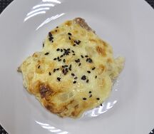 Свинина под шапкой с грибами