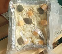 Жюльен из форели с шампиньонами, каперсами, вялеными томатами, сыром чеддер и моцареллой