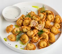 Чучвара с телятиной, жаренная с соусом мацони