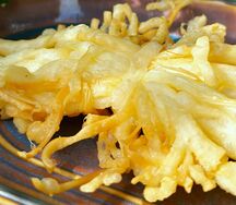 Сыр-косичка копченый жареный