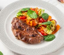 Стейк из свинины с соте из овощей