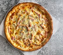 Пицца с ветчиной и грибами маленькая
